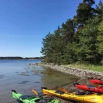 Our colorful kayaks are ready for adventure and this is where your paddling journey begins.