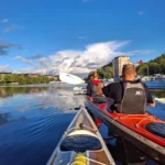 Kayaking through Stockholm’s waterways, just before sunset.